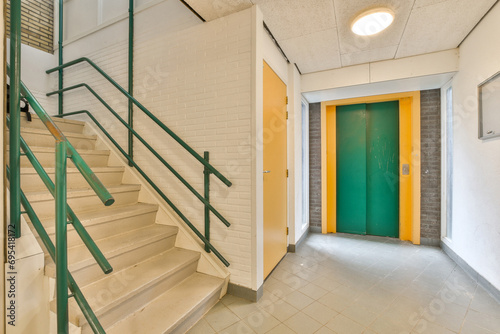 Modern building with green elevator door photo