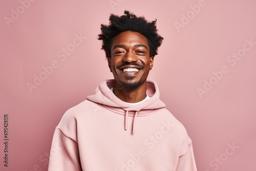 Portrait of a merry afro-american man in his 30s dressed in a comfy fleece pullover against a pastel or soft colors background. AI Generation