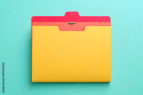 Yellow File Folder with Red Tab on Teal Background photo