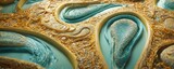 a close up of a gold and blue glass sculpture