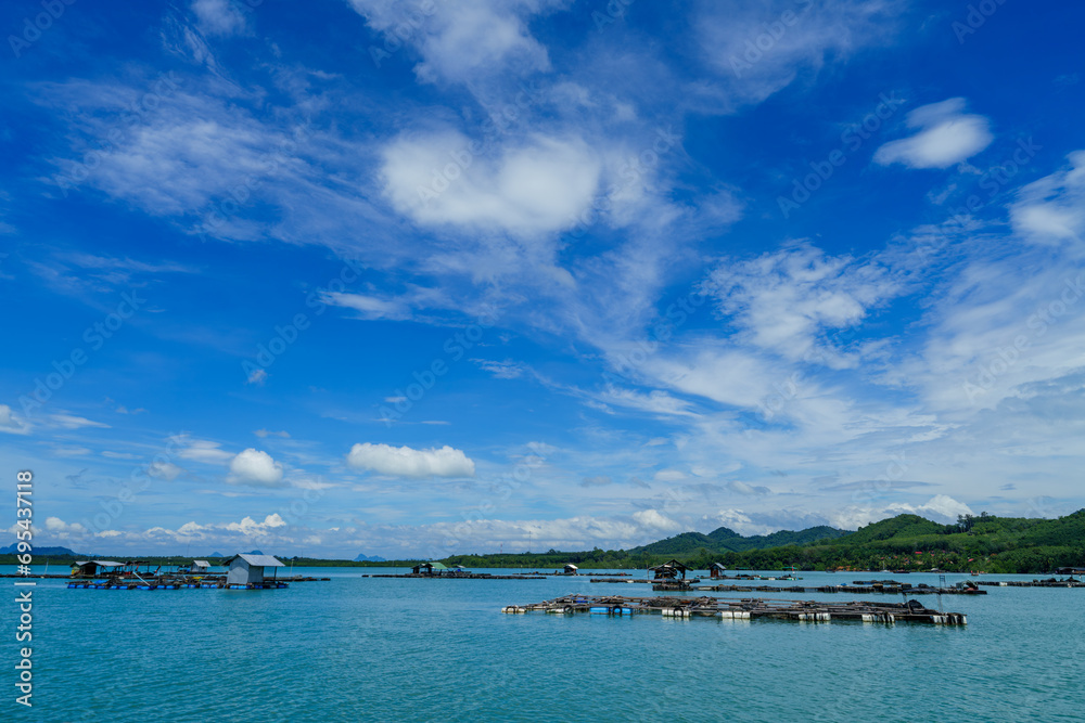 View of Andaman sea Phangnga bay, Aquaculture fish farming in cages fishs organic farm is occupation of local fishermen, Natural aquaculture, ecotourism and culture at Koh Yao, Phang Nga, Thailand.