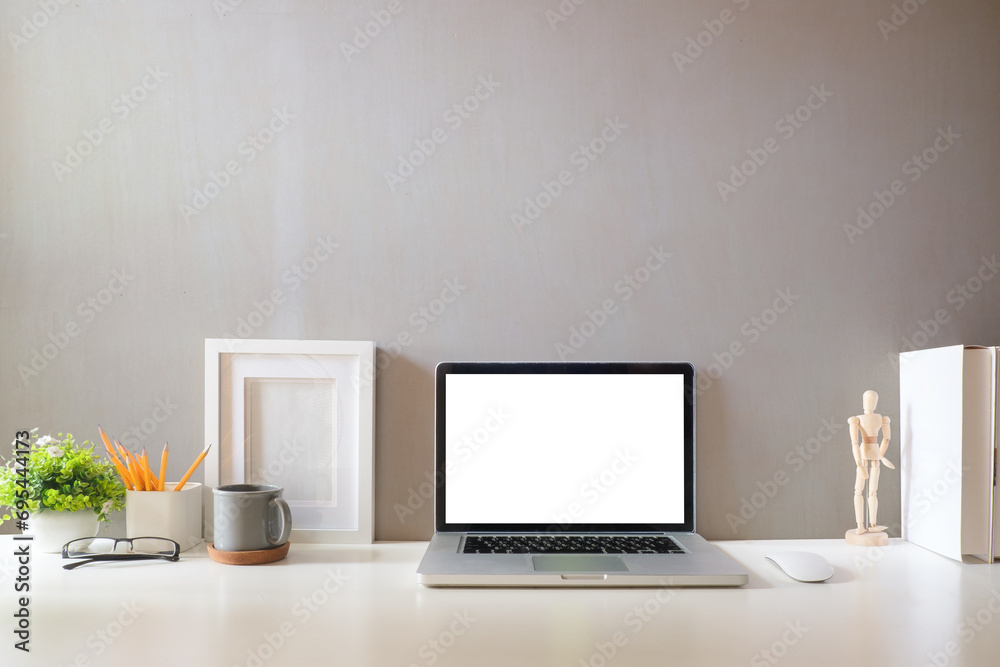 Front view laptop computer with empty screen on white table in bright room. Front view laptop computer with empty screen on white table in bright room.