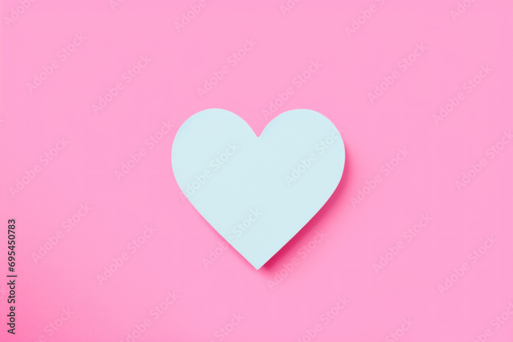 White heart on pink background. Concept of love and simplicity.