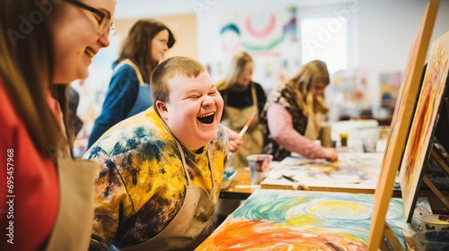 Boy with down syndrome happy in an art therapy class photo