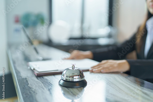 Hotel receptionist in uniforms at desk in lobby Friendly and welcome staff in hotel reception counter