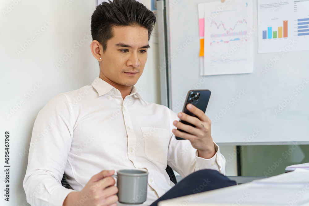 Asian Business man working with laptop. Young business man thinking Concentrated at work Asian Business man working with laptop. Young business man thinking Concentrated at work