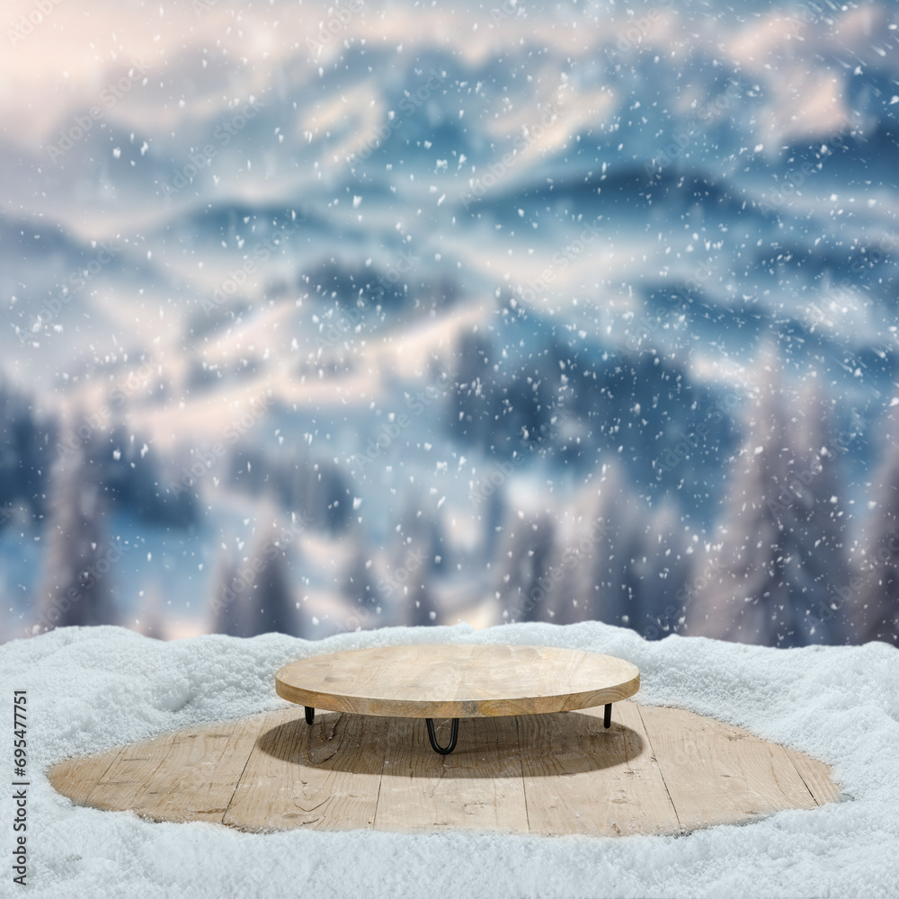 Wooden board cover of snow and frost. Blurred landscape of mountains and forest. Snowflakes and natural sun light. Empty space for your products. Mockup background with pedestal. 