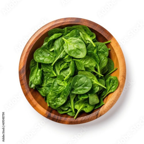 Fresh spinach leaf in wooden bowl on white background