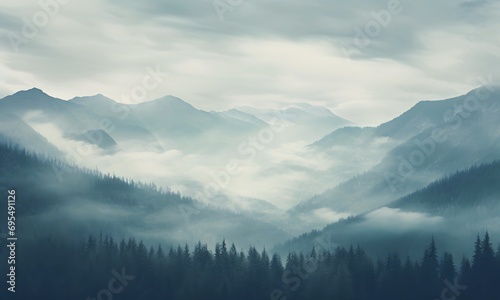 A Landscape Of High Mountains In The Grey Clouds Against A Background Of A Cloudy Sky photo