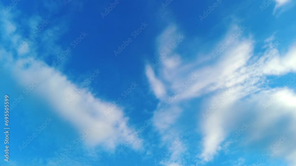Cumulus patchy clouds moving in the blue sky during bright sunny summer day, timelapse Cumulus patchy clouds moving in the blue sky during bright sunny summer day, timelapse