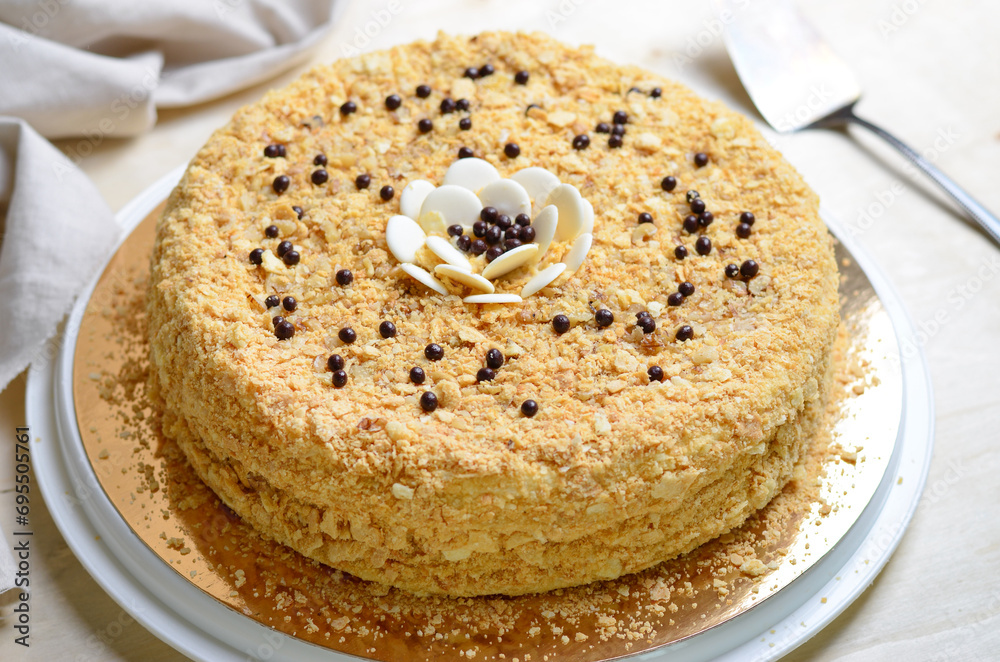 Delicious Napoleon Cake, Delicate Handmade Dessert with Custard and Puff Pastry Layers on Bright Background Delicious Napoleon Cake, Delicate Handmade Dessert with Custard and Puff Pastry Layers on Bright Background
