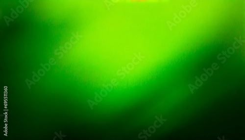 abstract green blurred background with dark edges © Lauren