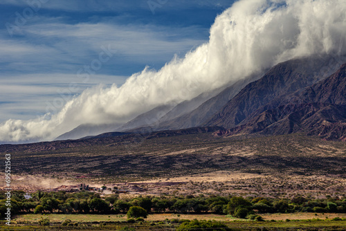 Landscape of clouds over the mountain at sunset in the Calchaquí Valley (Argentina). photo