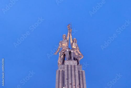 Soviet monument to Worker and Collective Farm Woman in evening against blue winter sky, VDNKh photo