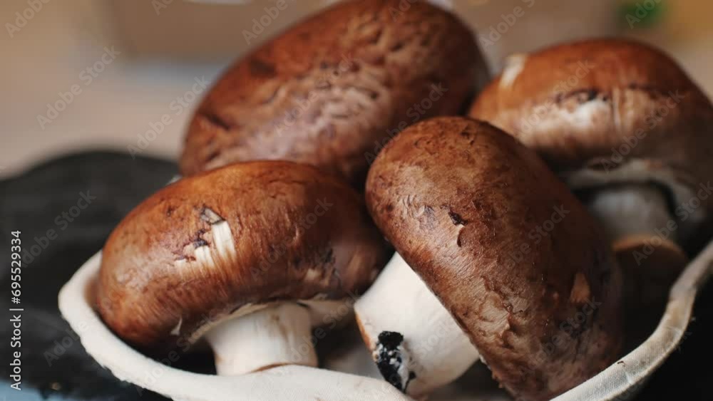 Fresh champignon mushrooms big portobello, macro, side view, background, chef man hold supermarket food. Fresh champignon mushrooms big portobello, macro, side view, background, chef man hold supermarket food.