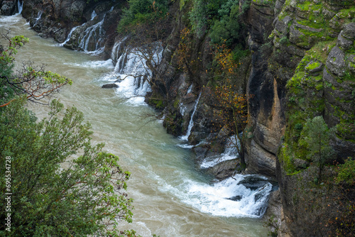 Transparent waters of Kopru River (Köprüçay, ancient Eurymedon) with its emerald green colour in Koprulu Canyon (Köprülü Kanyon) National Park, Antalya, Turkey. It's a rafting paradise photo