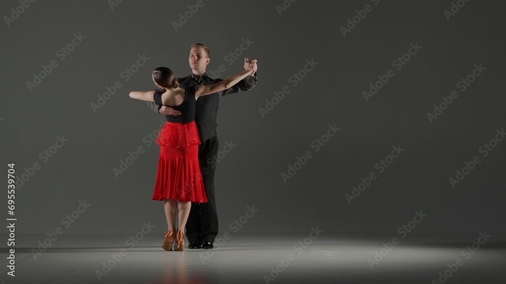 Elegant Ballroom Dance Couple on Spotlight.