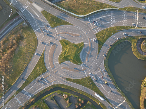 Turbo traffic square roundabout  Westerleeplein in Maasdijk. Aerial drone view. Complex intersection.