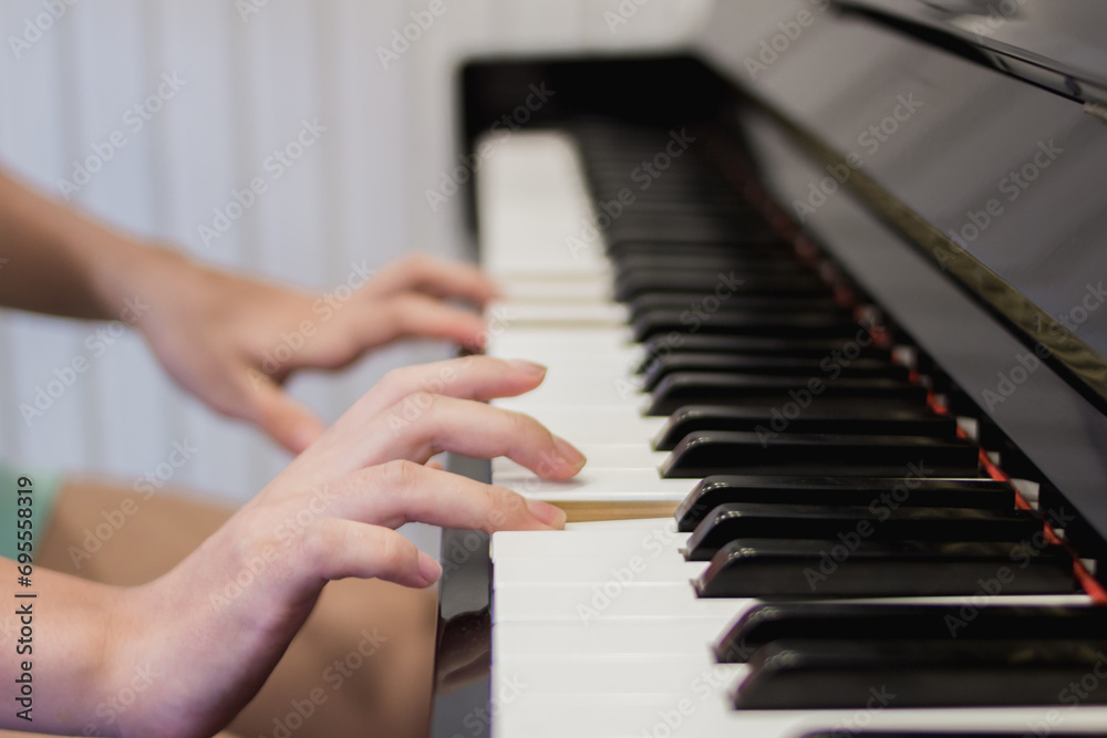 Fototapeta premium Beautiful piano background are set by the window in the morning waiting for the pianist to come to practice in the morning to reduce the mistake of having to perform the piano performance at a concert