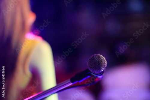 Photography A silver vintage-style microphone is housed in the practice room to prepare singers to practice vocals through a quality microphone and record vocals to keep listening to improve their singing