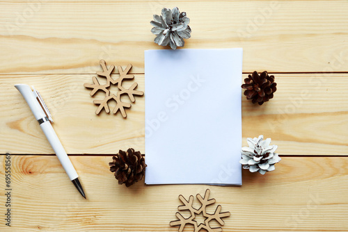 mockup blank and christmas decoration on wooden background.