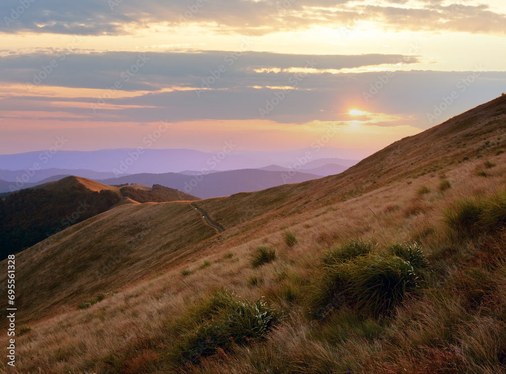 Autumn sunrise mountain view with grass and haze (Carpathian, Ukraine)