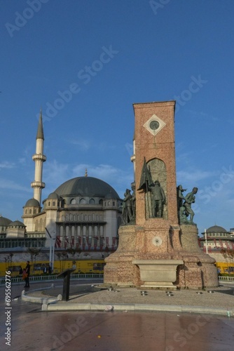 The Taksim Republic Monument, Taksim Square, Istanbul, Turkey, with Taksim Mosque in background, commemorating the founding of the Turkish Republic in 1923.