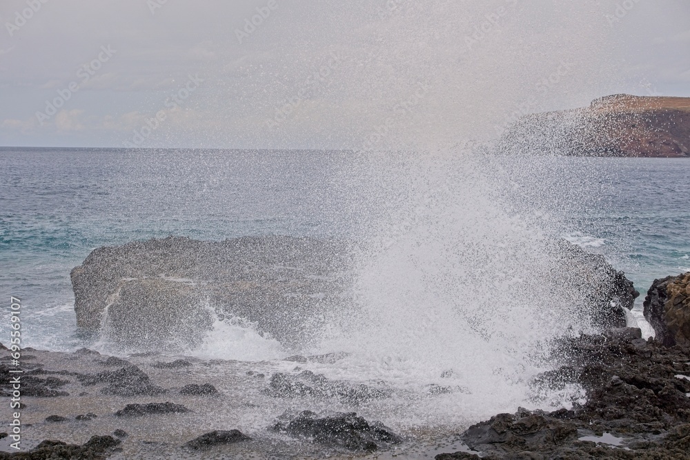 Waves breaking on the rocky beach in Agaete, Gran Canaria, Spain