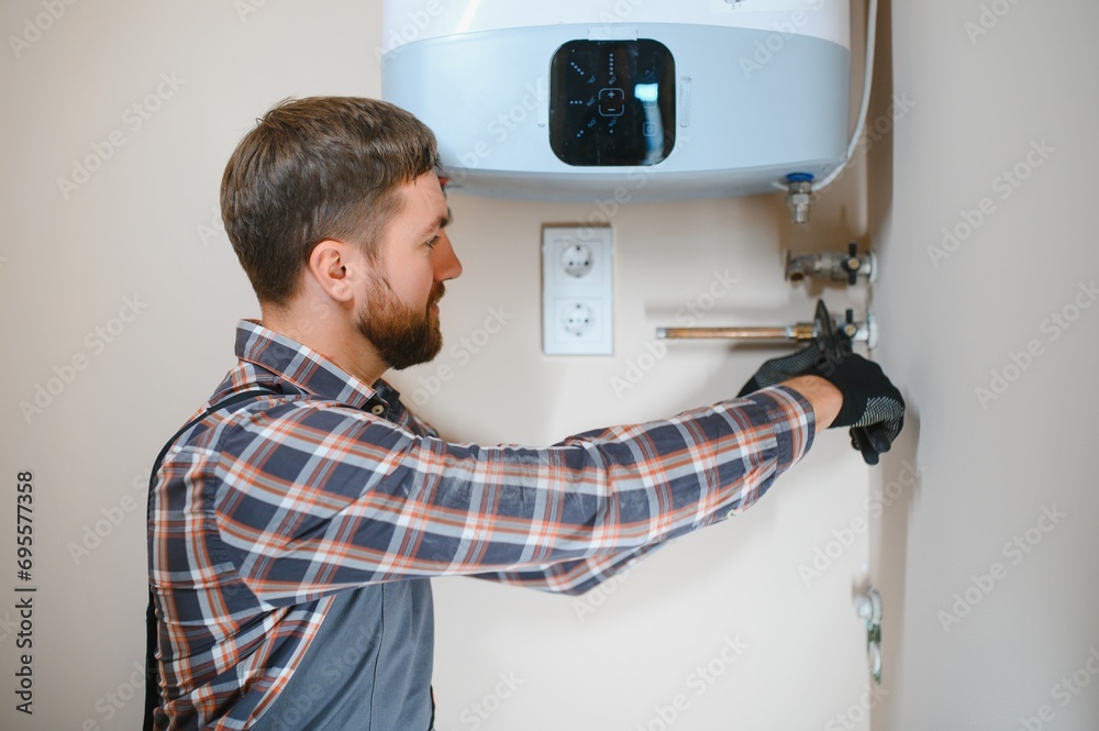 worker set up central gas heating boiler at home worker set up central gas heating boiler at home