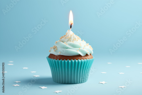 Birthday cupcake, with a candle on a blue background.
