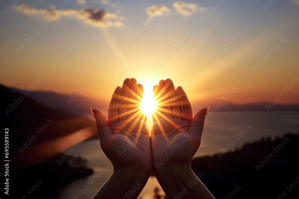 prayer raises his hands to sunshine or sunset, christian concept background - obrazy, fototapety, plakaty 