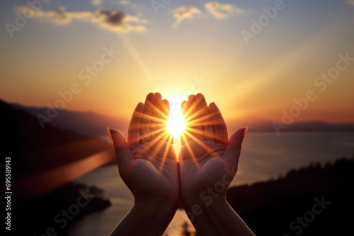 prayer raises his hands to sunshine or sunset, christian concept background photo