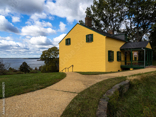 The intensely yellow visitor center house at Fort Washington, Virginia, overlooking the Potomac River.