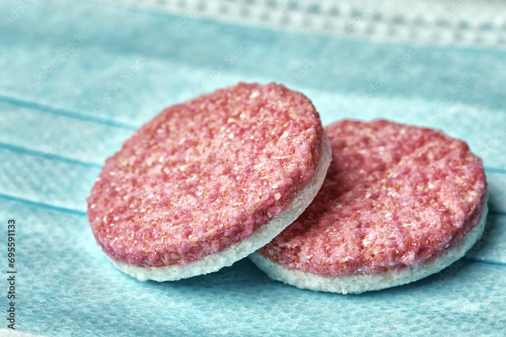 two large white-pink pills, photographed close-up. two large white-pink pills, photographed close-up.