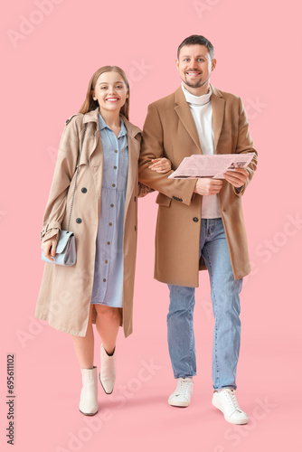 Young couple with newspaper...