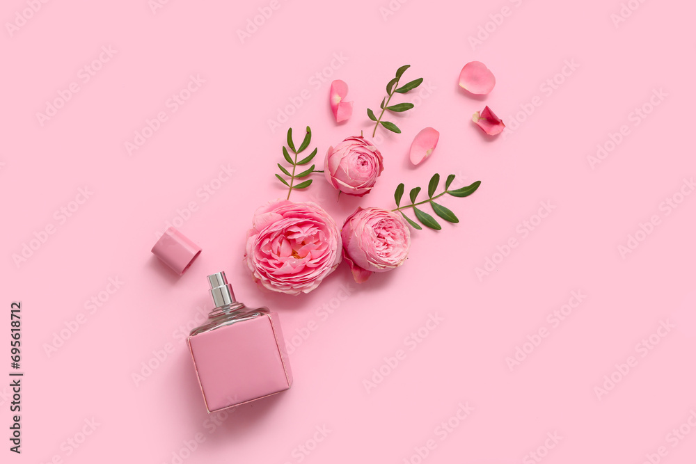 Beautiful composition with bottle of perfume and rose flowers on pink background - obrazy, fototapety, plakaty 