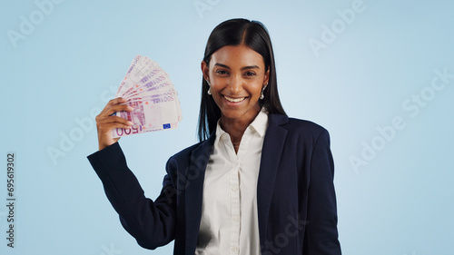 Happy business woman, portrait and money fan in financial freedom against a blue studio background. Excited female person or employee with cash, savings or investment for bonus salary on mockup space