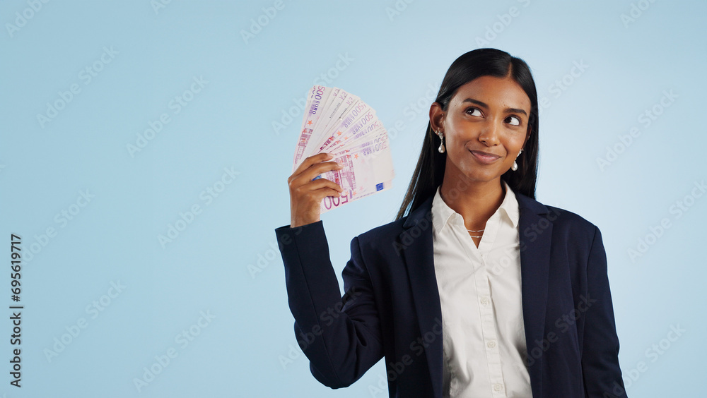Happy business woman, thinking and money fan in financial freedom against a blue studio background. Female person or employee in thought or wonder with cash, savings or investment on mockup space Happy business woman, thinking and money fan in financial freedom against a blue studio background. Female person or employee in thought or wonder with cash, savings or investment on mockup space