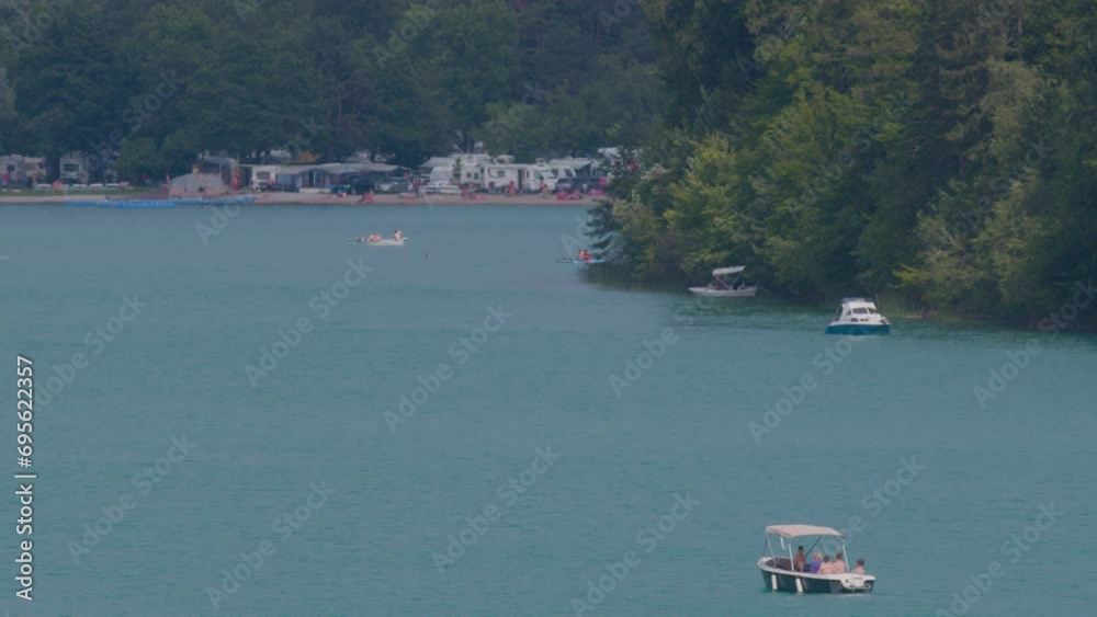 water sports, boats and SUPs on alpine Faaker See lake in Carinthia water sports, boats and SUPs on alpine Faaker See lake in Carinthia