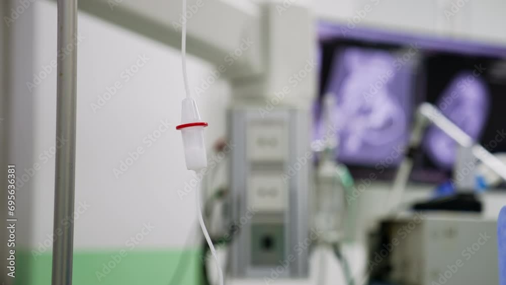 Drop counter reservoir with white medicine inside. Close up. Medical equipment in surgery room. Blurred backdrop. Drop counter reservoir with white medicine inside. Close up. Medical equipment in surgery room. Blurred backdrop.