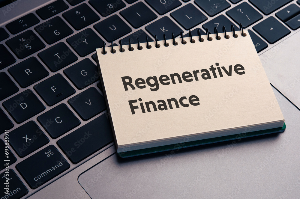 There is notebook with the word Regenerative Finance. It is as an eye-catching image. There is notebook with the word Regenerative Finance. It is as an eye-catching image.