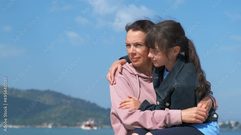 Motherhood by tropical bay. Happy mother with her daughter on a sunny day. Motherhood by tropical bay. Happy mother with her daughter on a sunny day.