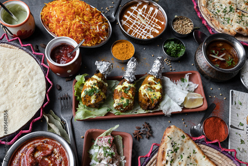 Variety of Indian food dishes on restaurant table