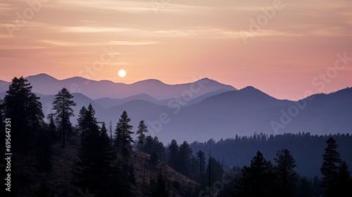 Pastel glow over forested mountains