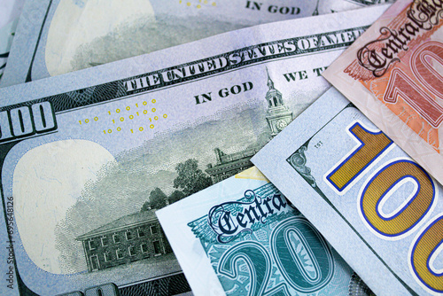 Foto Close-up view of one hundred dollar bills and new Egyptian banknotes currency ex