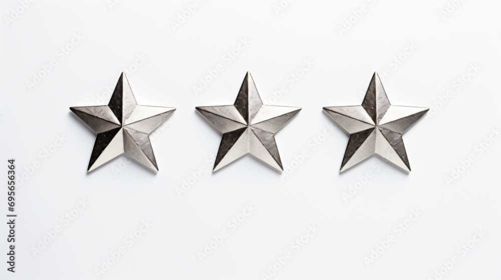 Obraz premium three metal stars are on a white surface