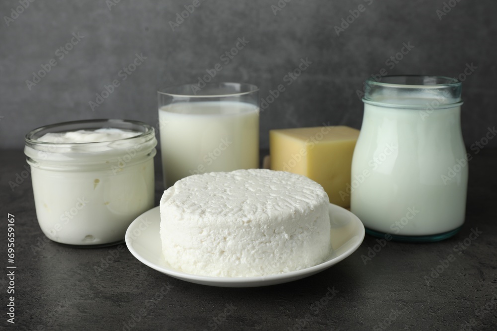 Fresh lactose free products on grey table Fresh lactose free products on grey table