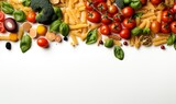 a variety of fresh vegetables and pasta scattered aesthetically on a clean white surface with copy space.