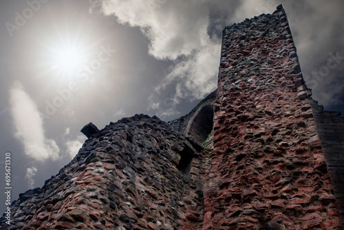 Bothwell Castle is a large medieval castle, sits on a high, steep bank, above a bend in the River Clyde in South Lanarkshire, Scotland. It is located between Bothwell and Uddingston, of Glasgow.   photo