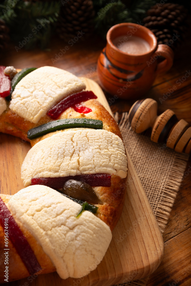 Three Kings Bread also called Rosca de Reyes, Roscon, Epiphany Cake, traditionally served with hot chocolate in a clay Jarrito. Mexican tradition on January 5th.